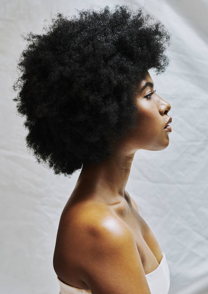 profile of a Black woman with short curly hair