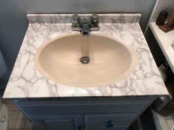 Reviewer photo of a sink covered in the contact paper