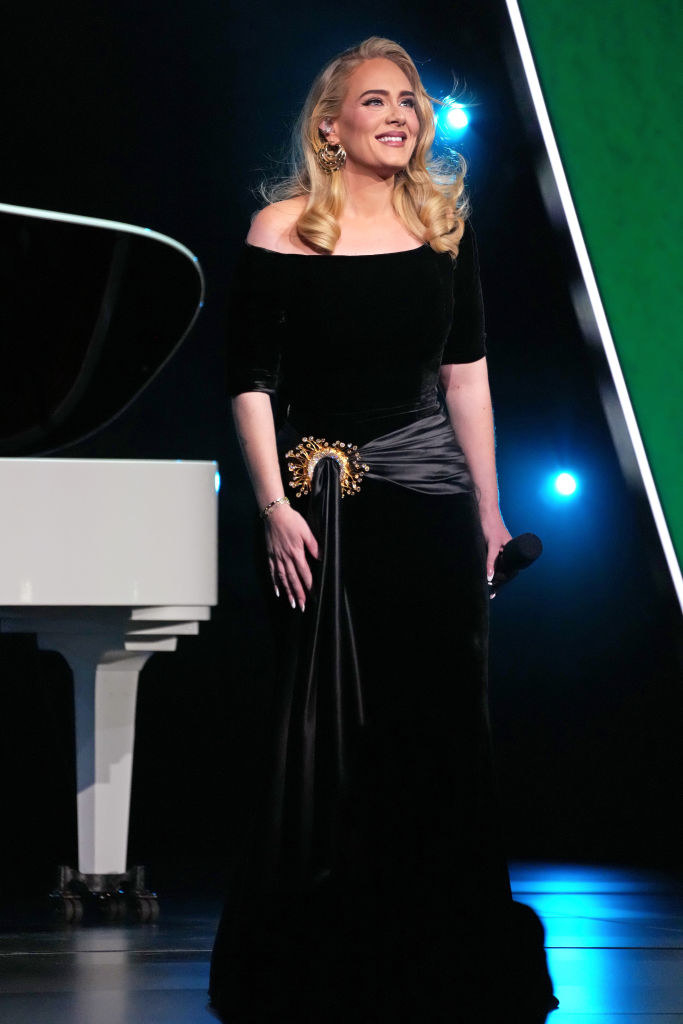 Adele in a gown onstage