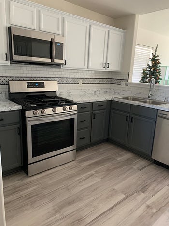 after image of same kitchen with white cabinets and new hardware