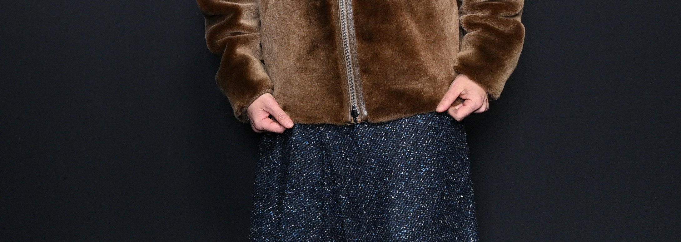 A close-up of the tweed skirt