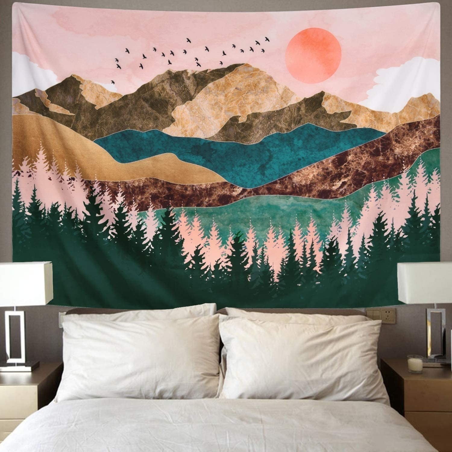The vividly colored tapestry, featuring trees, mountains, birds, and more, hanging above a bed