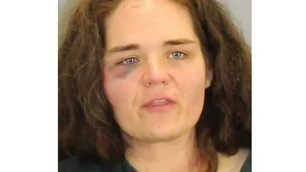 An Ohio woman who was filmed spraying airline employees and travelers with a fire extinguisher at Atlanta airport has been arrested by authorities.