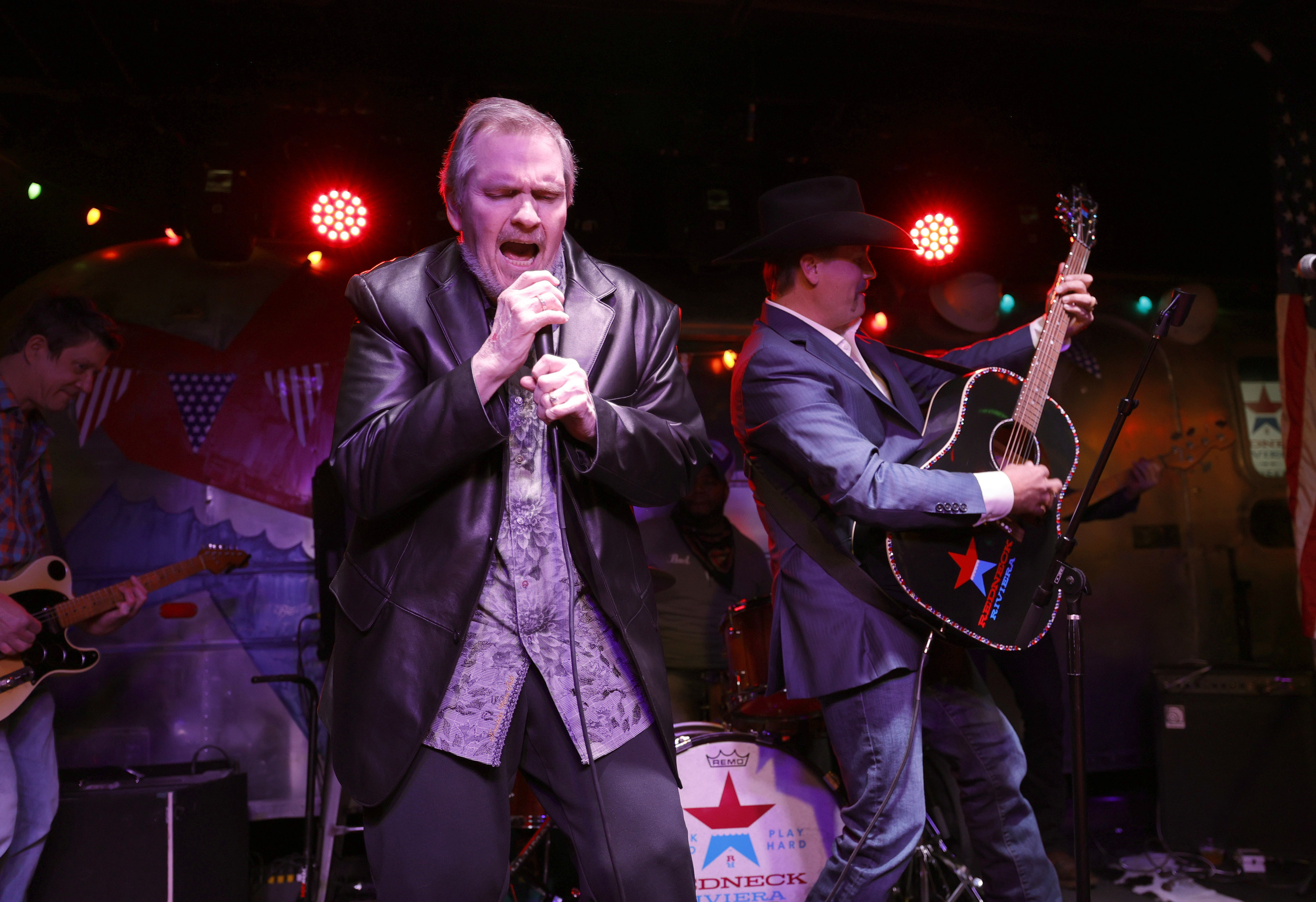 Meat Loaf and John Rich performing onstage in 2021