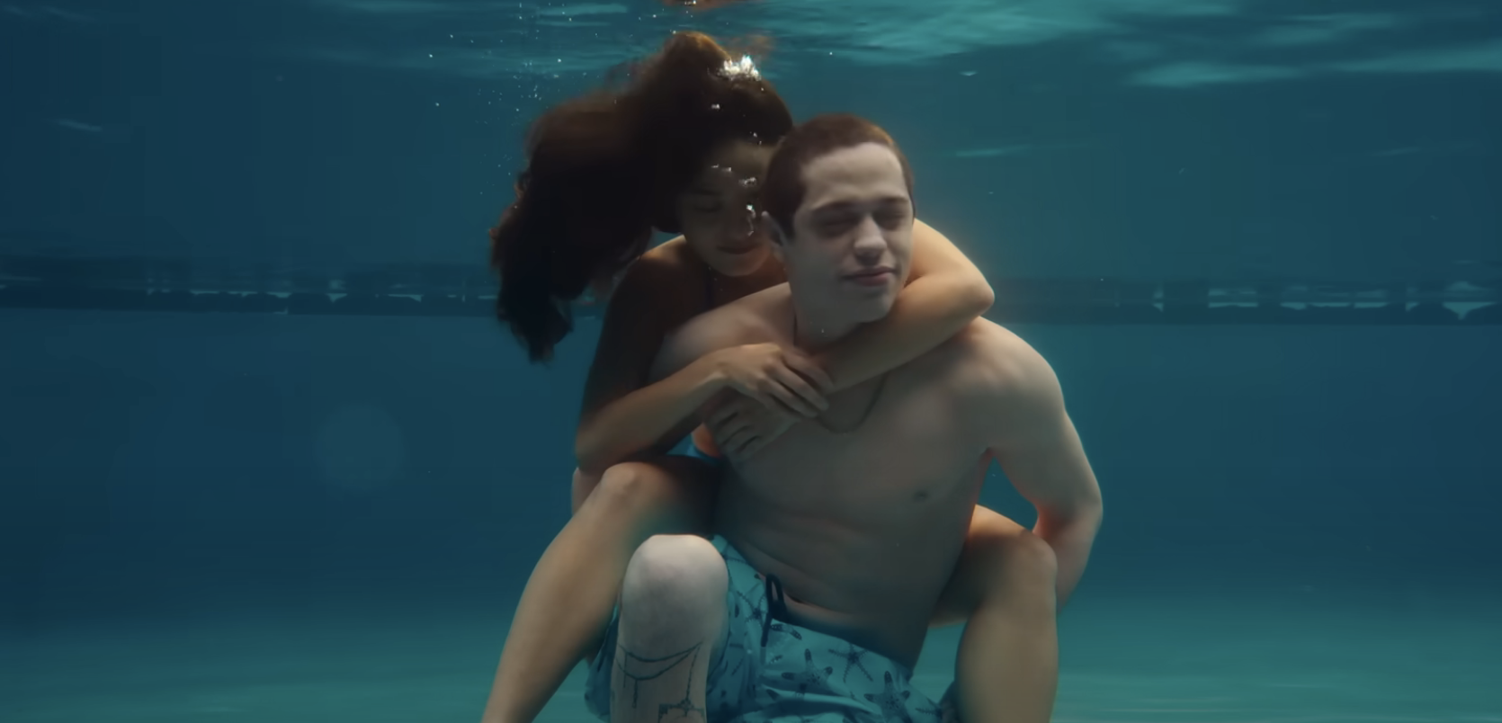 pete holding chase on his back underwater in the film