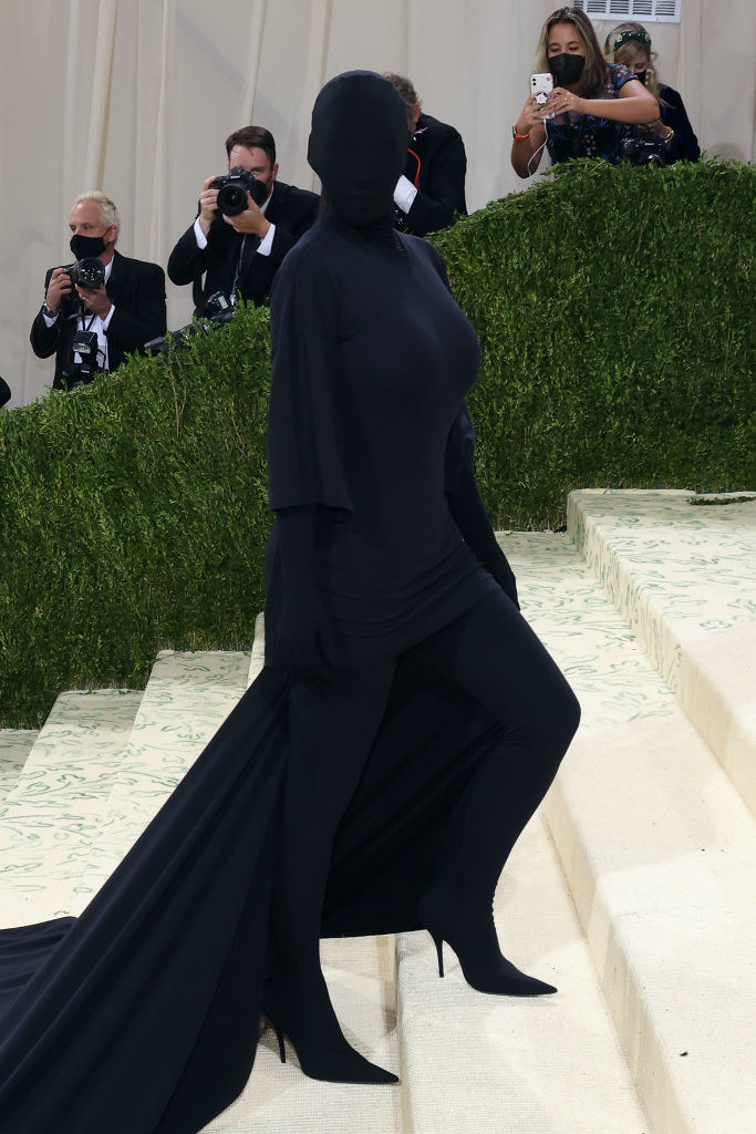 Kim completely covered head to toe in black cloth
