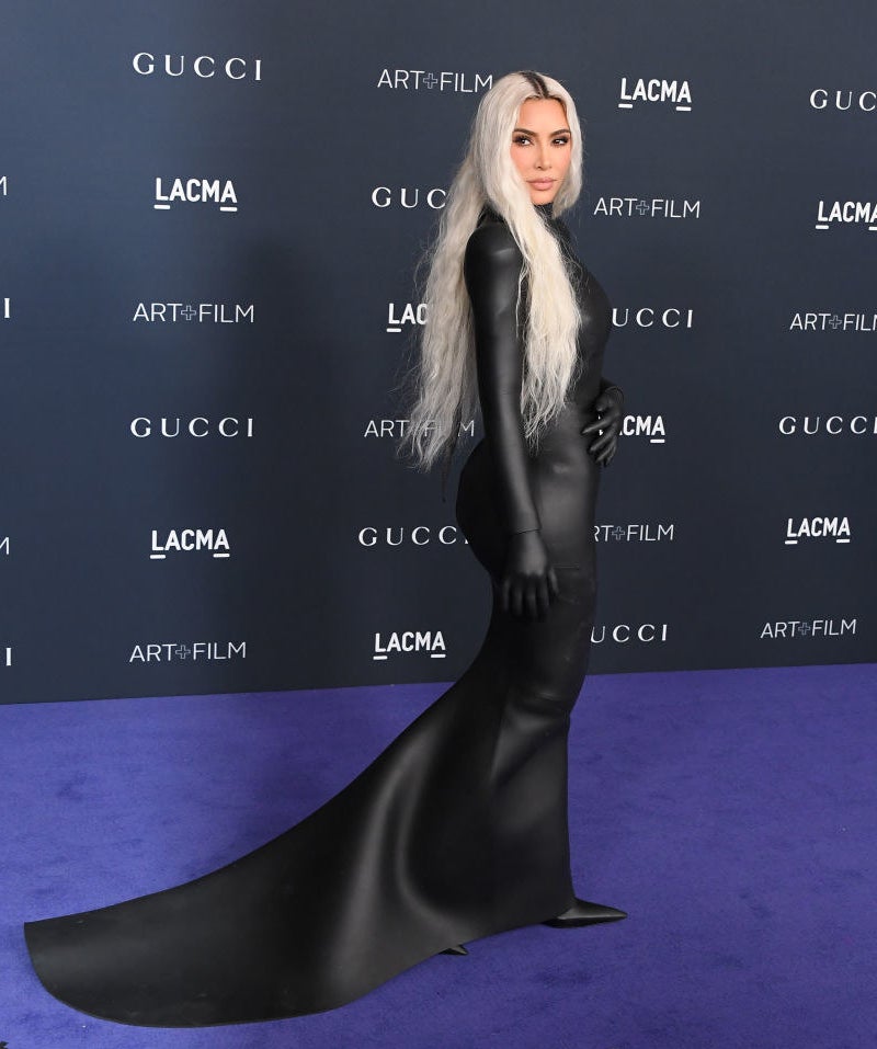 Kim in a leather dress with long silver hair