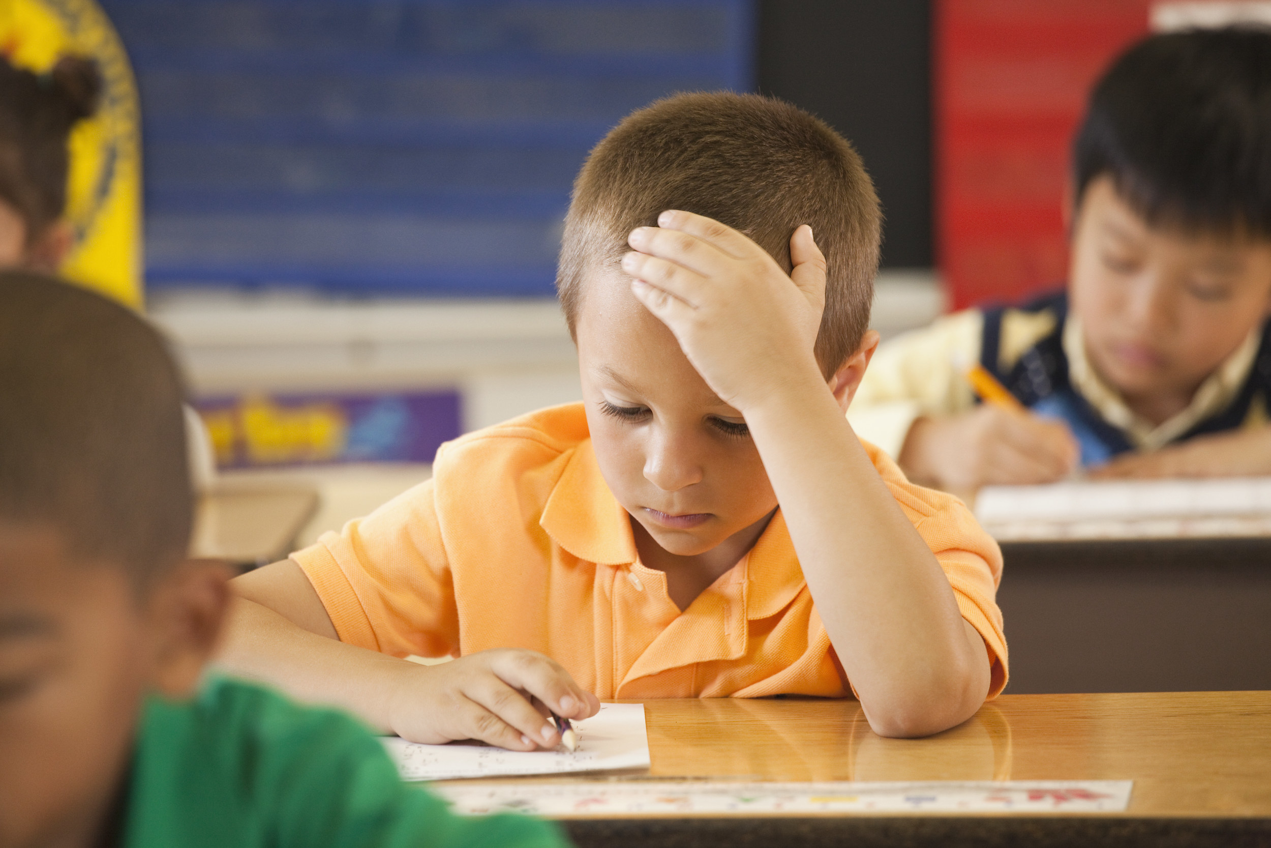 A little boy in class