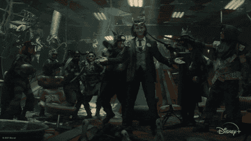 a group of people wearing masks hold weapons to loki&#x27;s throat
