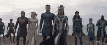 the eternals stand on a beach