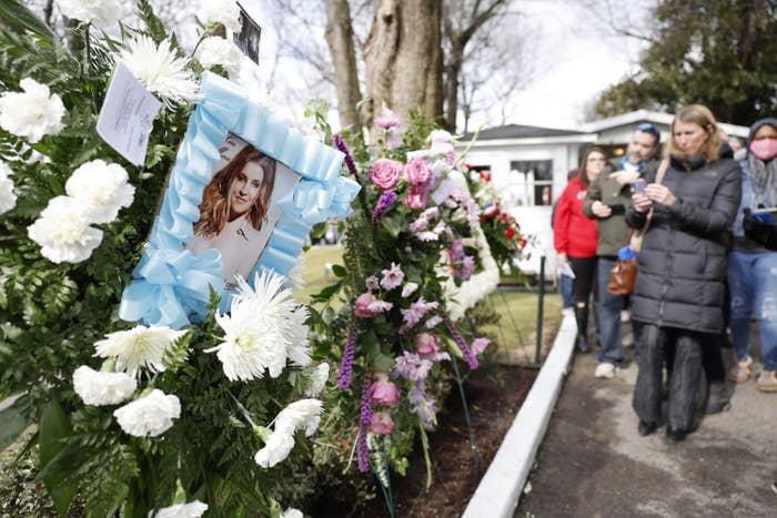 Lisa Marie&#x27;s framed photo appears amid floral tributes