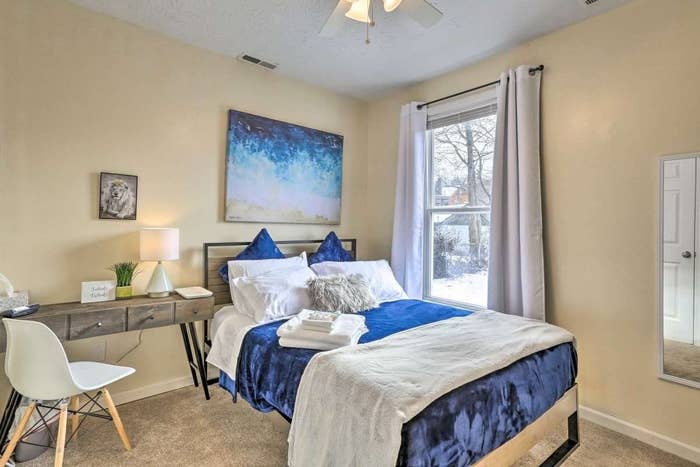 Reviewer's bed with the blue and grey fleece blankets on top as bedding