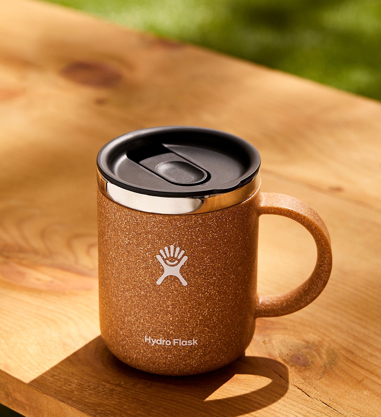 a hydro flask mug with a spill-proof lid