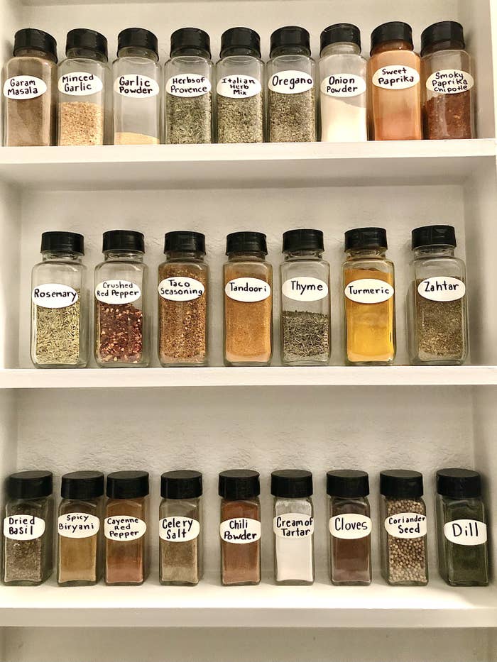 Various spices neatly arranged with home made labels.