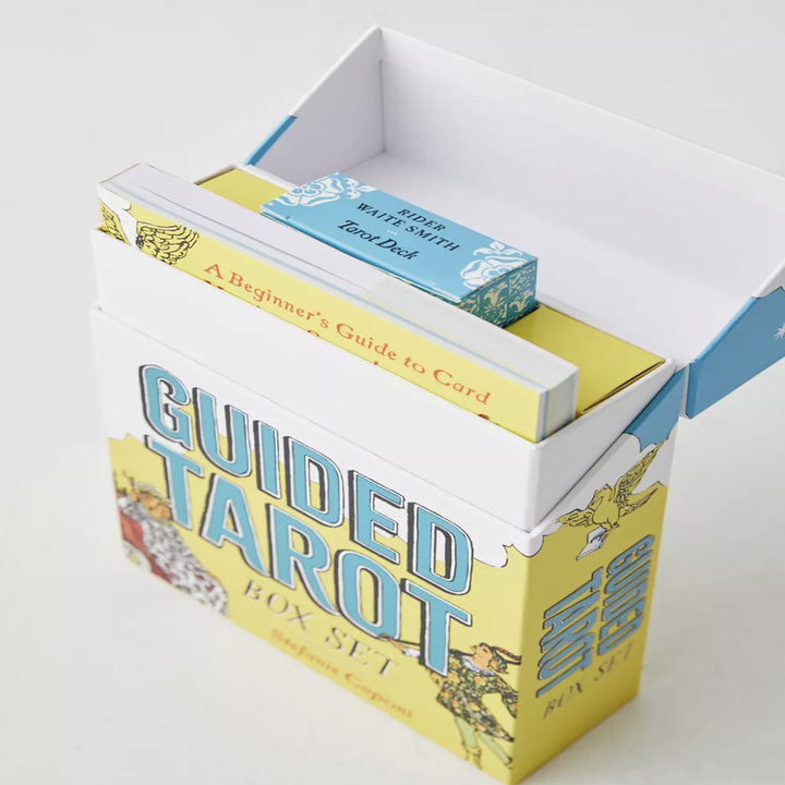 the box with the book and cards inside