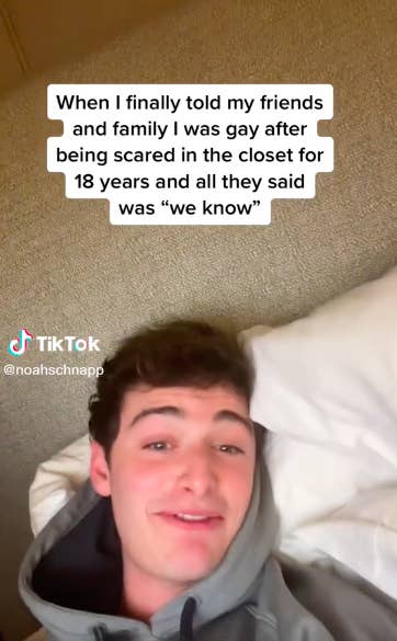 Noah in a hoodie and laying in bed during his TikTok