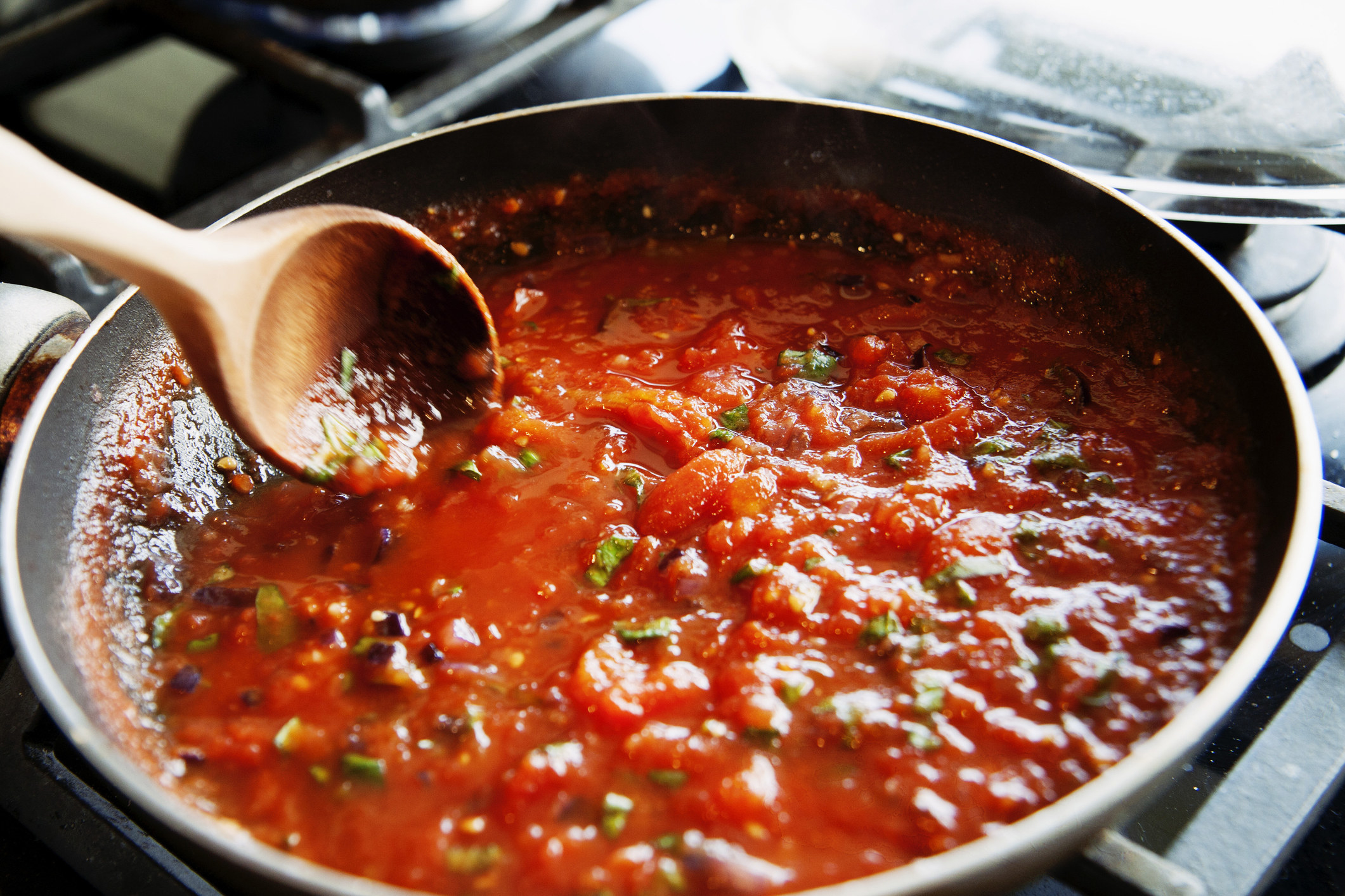 Preparing fresh tomato sauce.