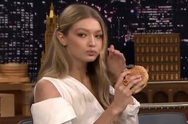 Gigi Hadid eating a cheeseburger