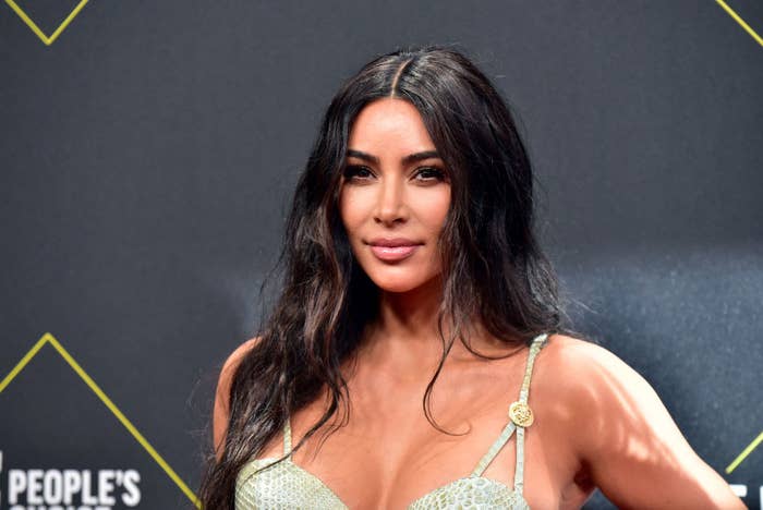 A closeup of Kim posing on the red carpet of the People's Choice Award