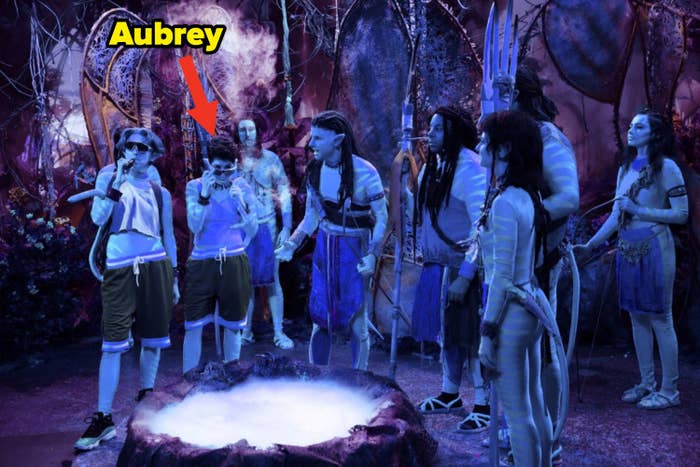 Cast members dressed as Na'vi as they standing around bubbling volcanic-like opening