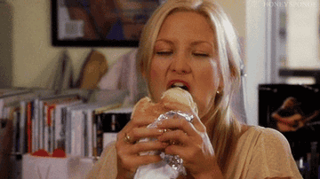 Kate Hudson eating a burger very happily