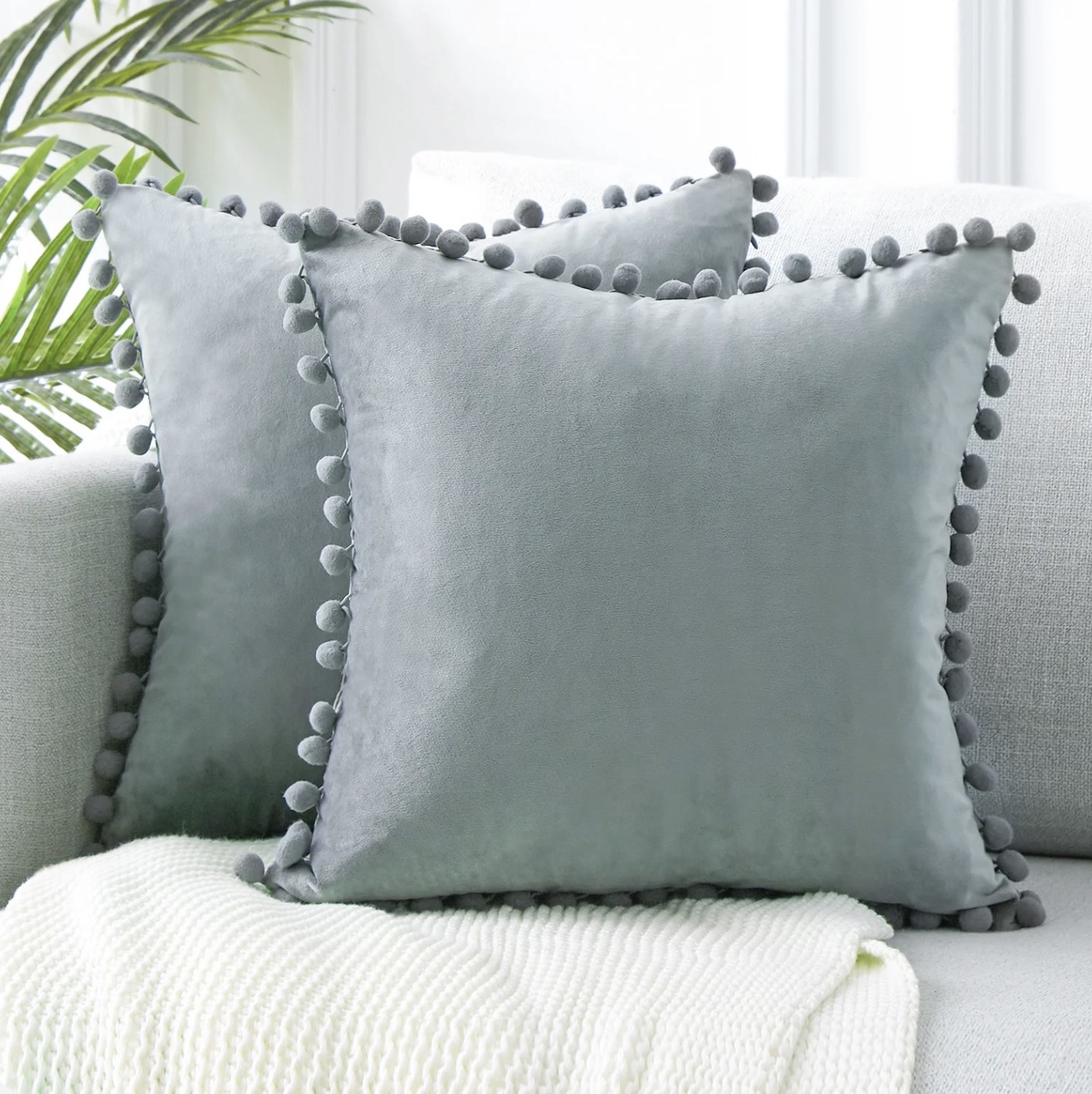 Two grey throw pillows