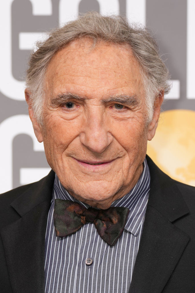 A closeup of Judd Hirsch at a red carpet event wearing a jacket and bowtie