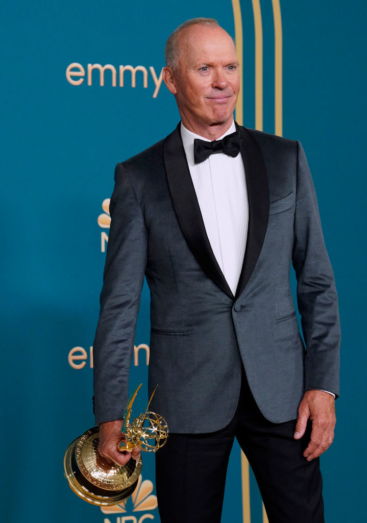 Michael Keaton holding his Emmy