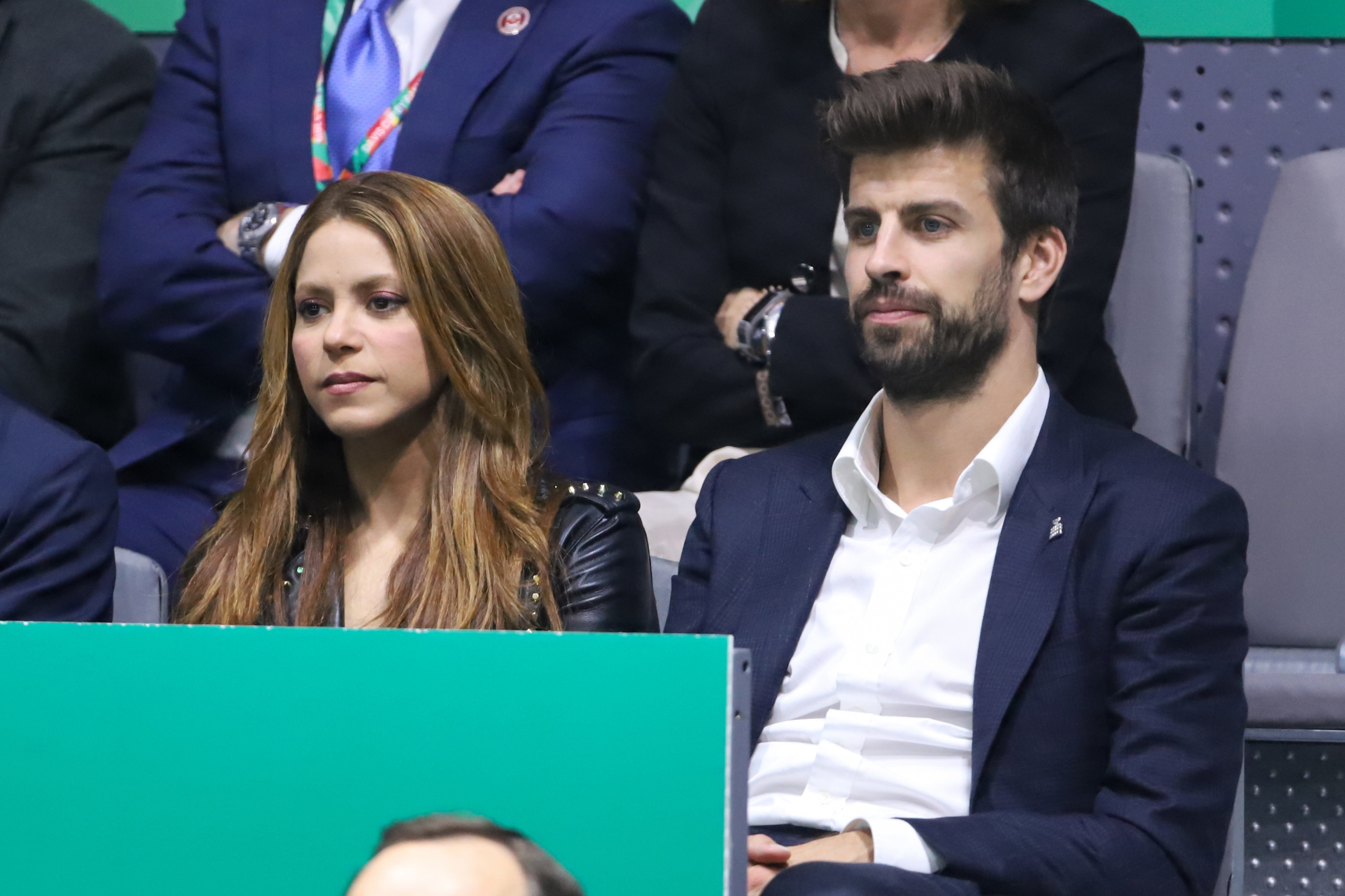The former couple sitting next to each other a sporting event