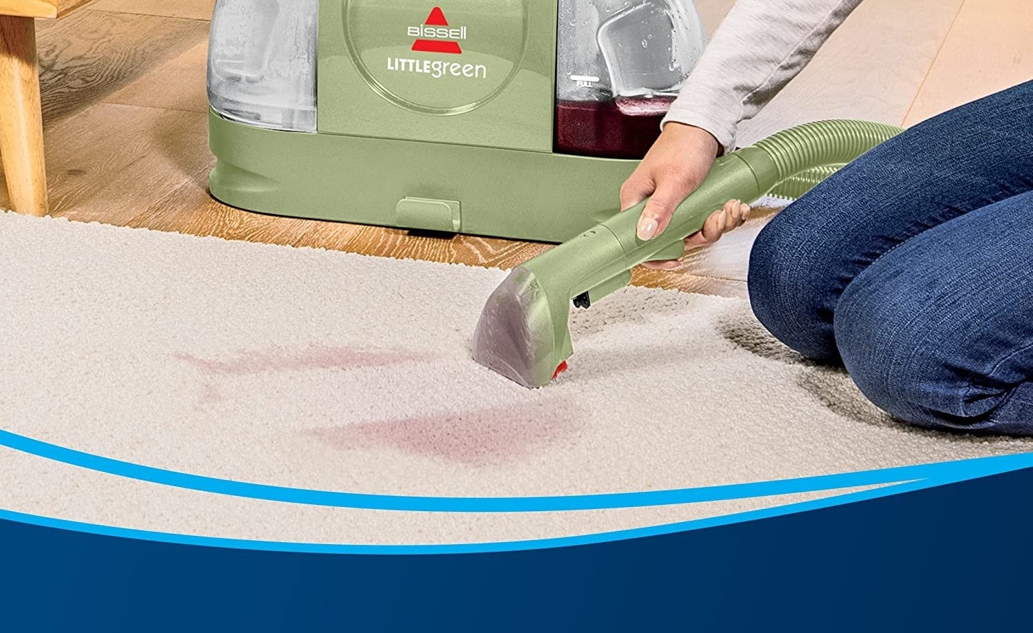 A person using the Little Green on their carpet