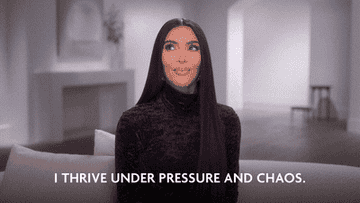 Kim Kardashian saying &quot;I thrive under pressure and chaos.&quot;