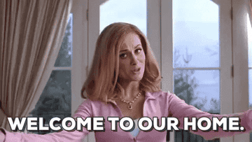 a gif of amy poehler from mean girls saying welcome to our home