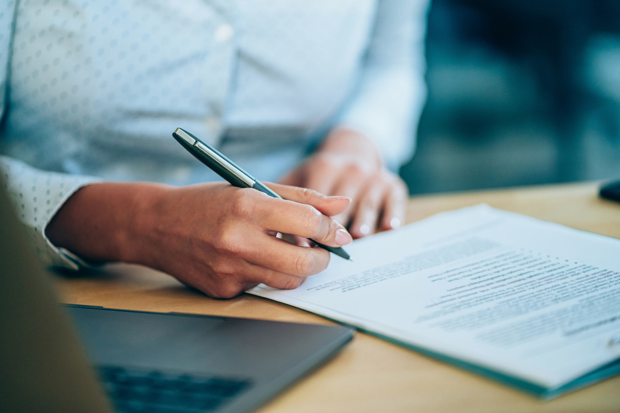 Person signing employment contract