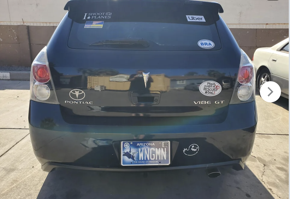 car with the license plate reading &quot;WNGMN&quot;