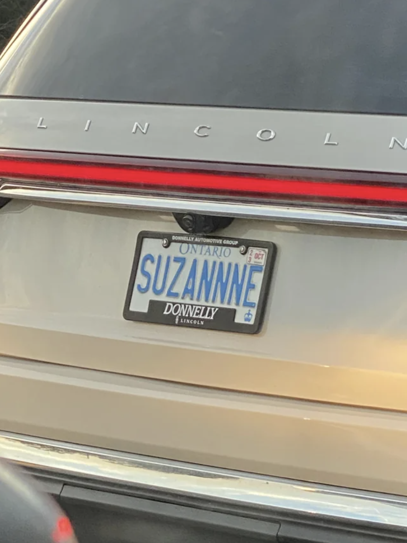 car with the license plate reading &quot;SUZANNNE&quot;