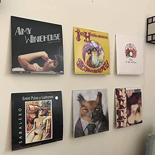 six records displayed on a wall