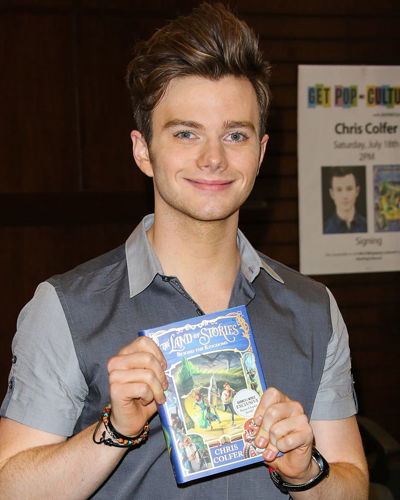 chris holding his book