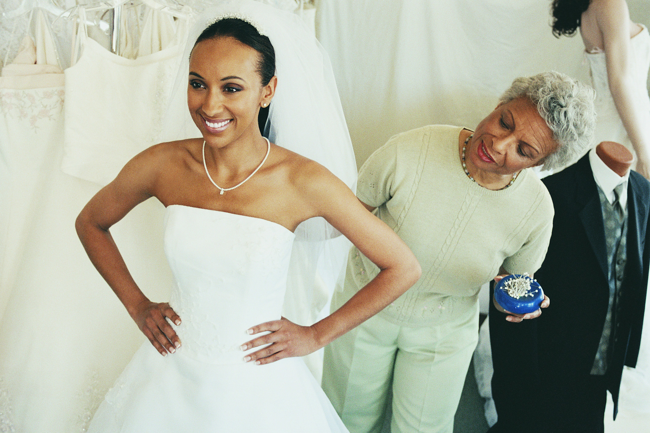 woman trying on a wedding dress