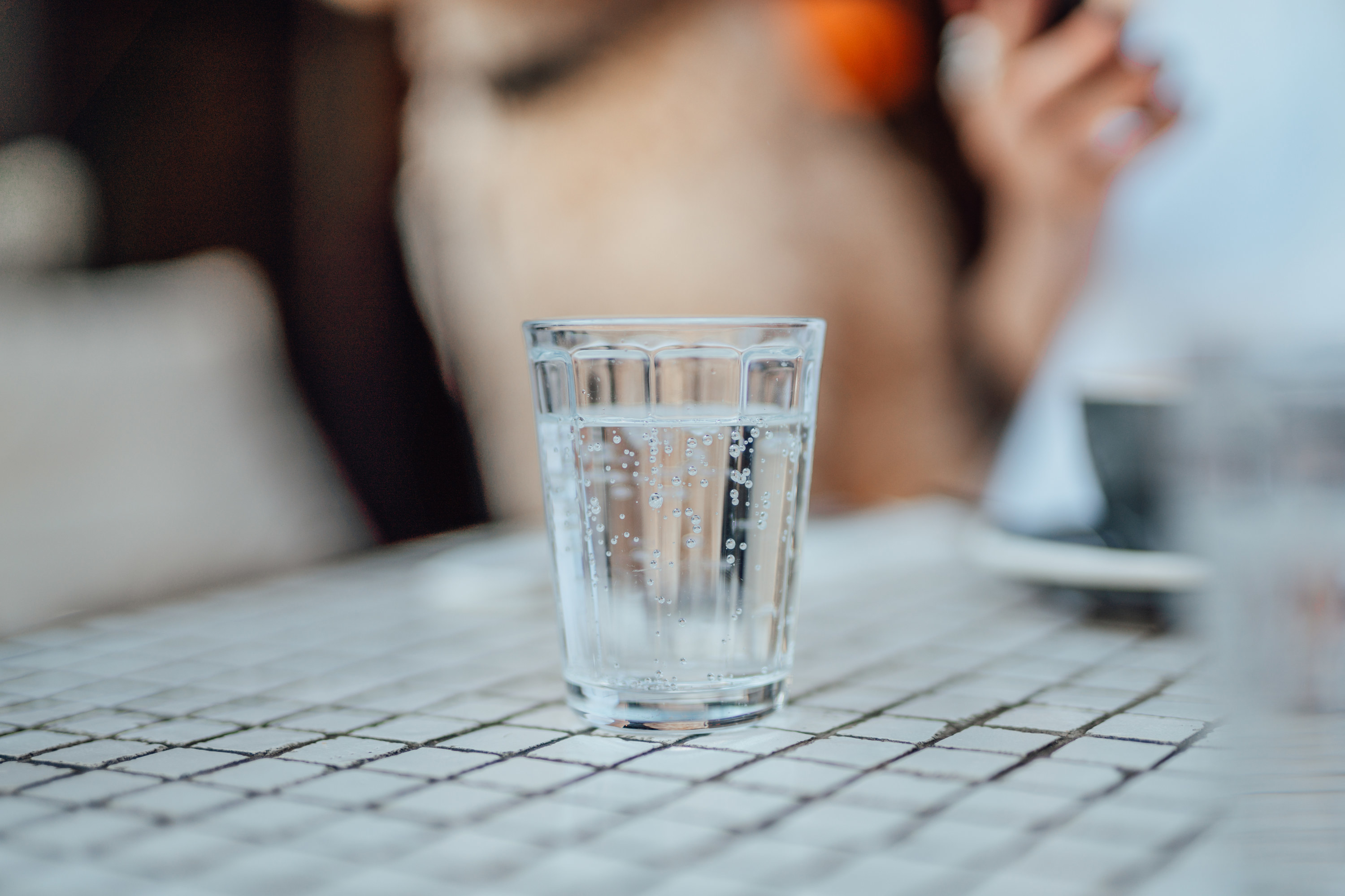 a glass of water on top of a table