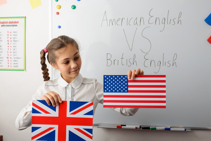 kid holding the england and usa flag