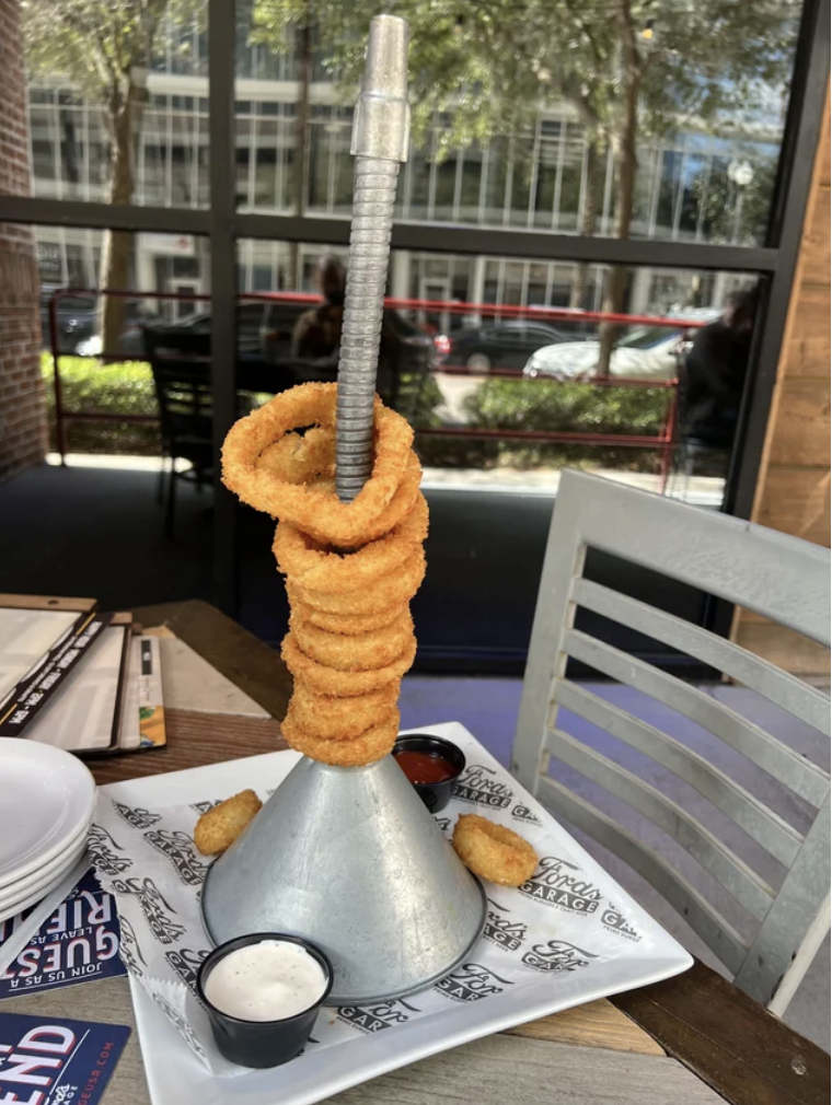 Onion rings on a funnel and looking like a ring toss game