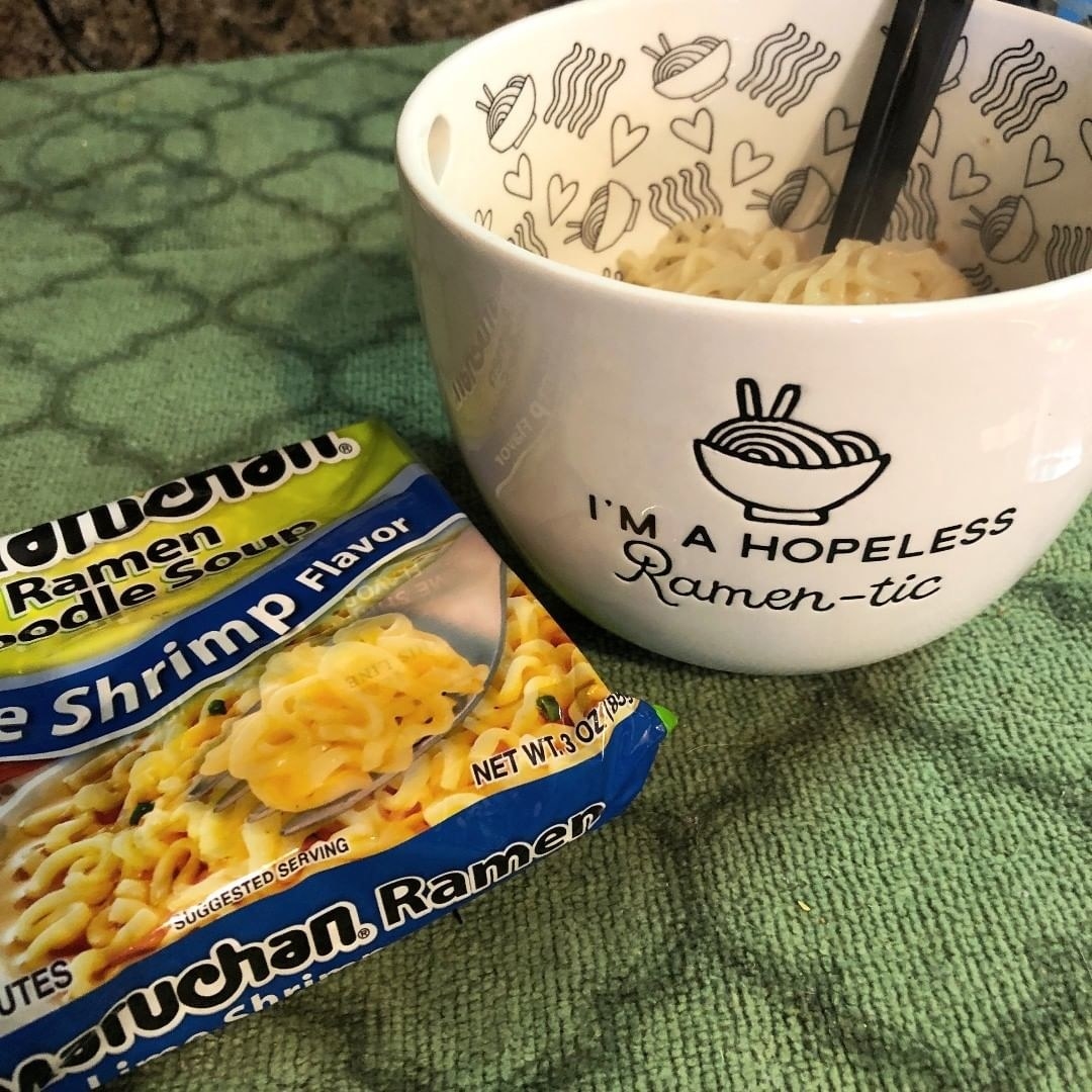The bowl next to a pack of ramen