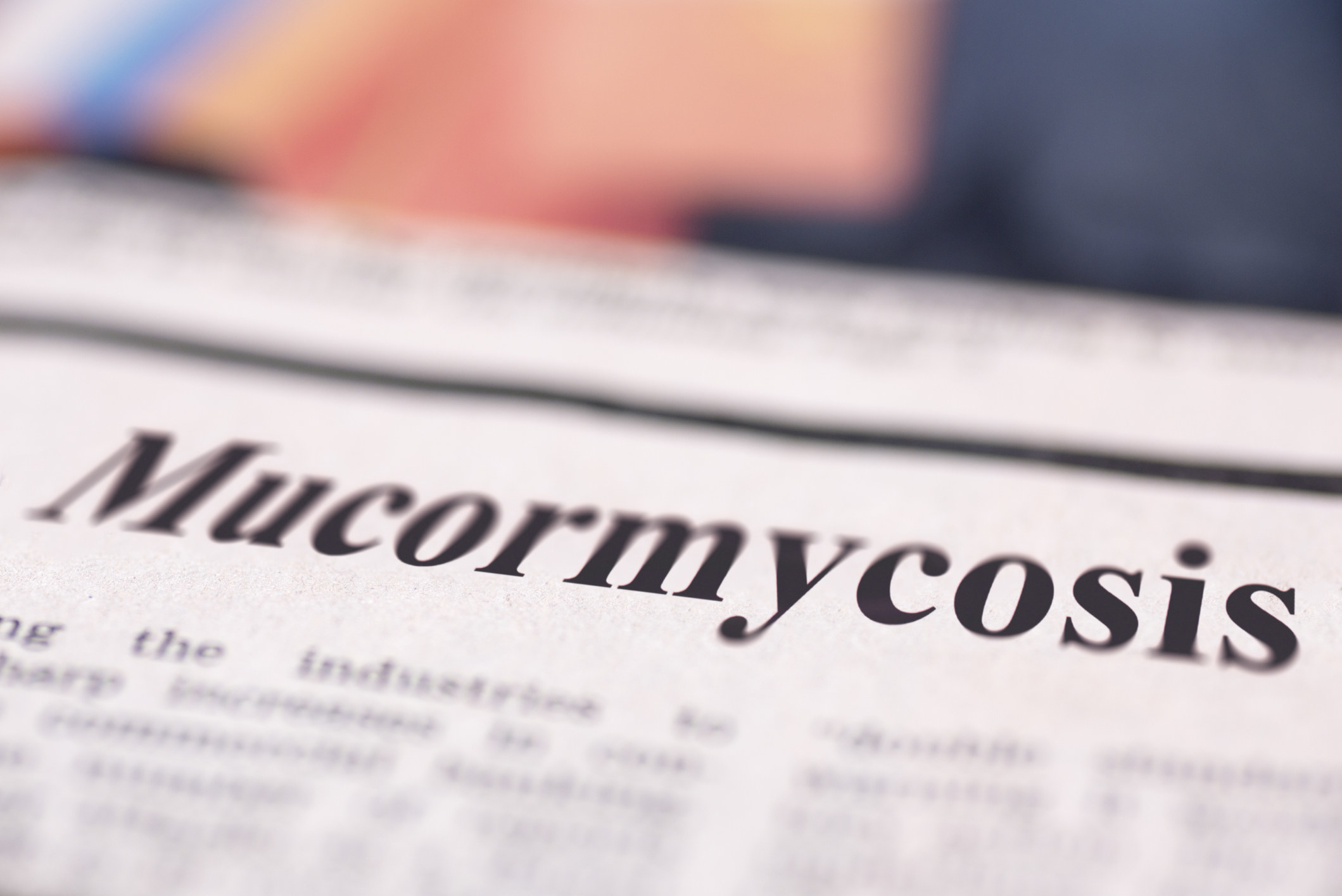 Mucormycosis written newspaper close up shot to the text