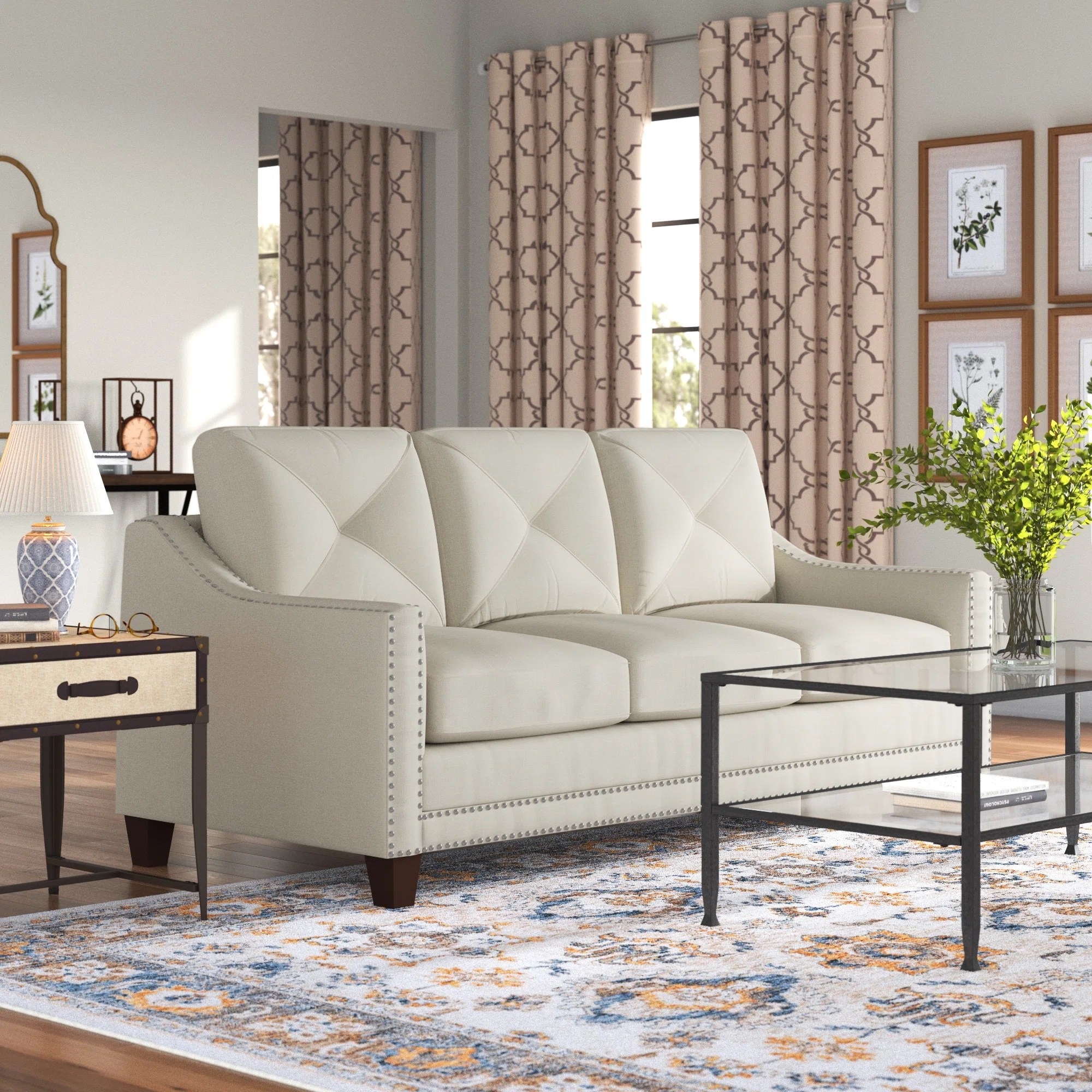 a taupe sofa with metal tufts in a cozy living room