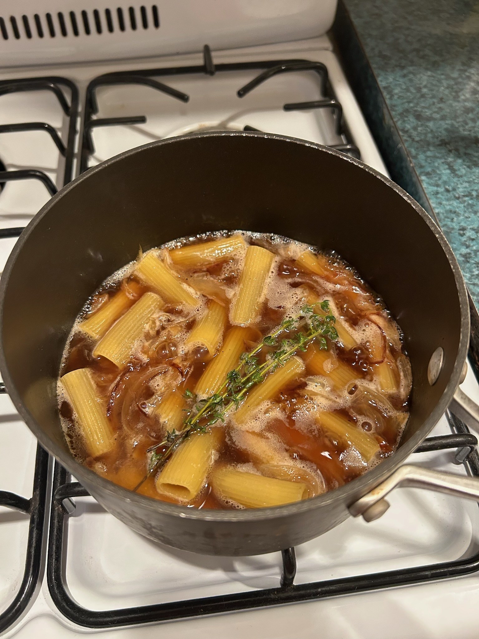 Rigatoni mixture cooking on the stove