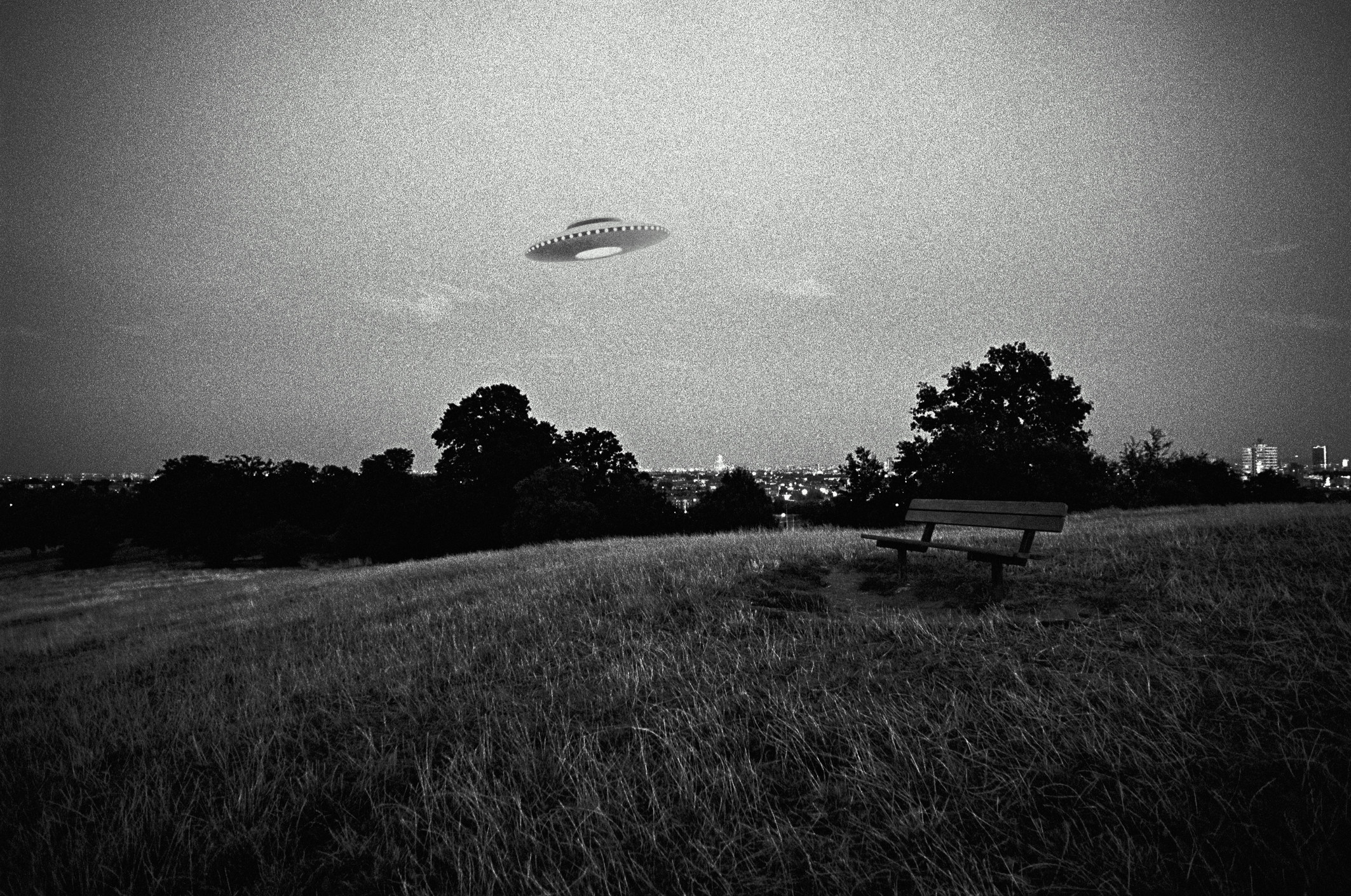 ufo hovering over a field