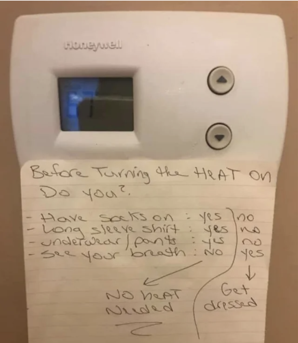Handwritten note on thermostat &quot;Before turning the heat on, do you&quot; and asking if they have socks on, are wearing a long-sleeved shirt and underwear/pants, can see their breath, and saying to get dressed if they answer yes, not turn the heat on