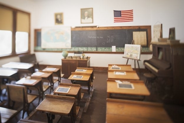 A classroom with an American flag hanging.