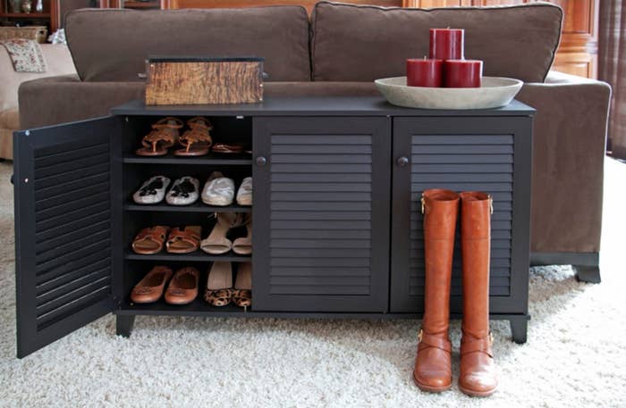 The shoe storage cabinet in the color Espresso/Wood Knobs