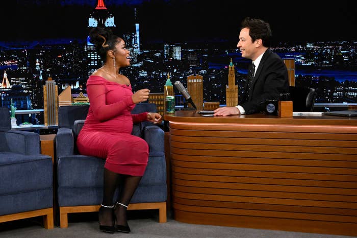 Keke is sitting and speaking to Jimmy Fallon